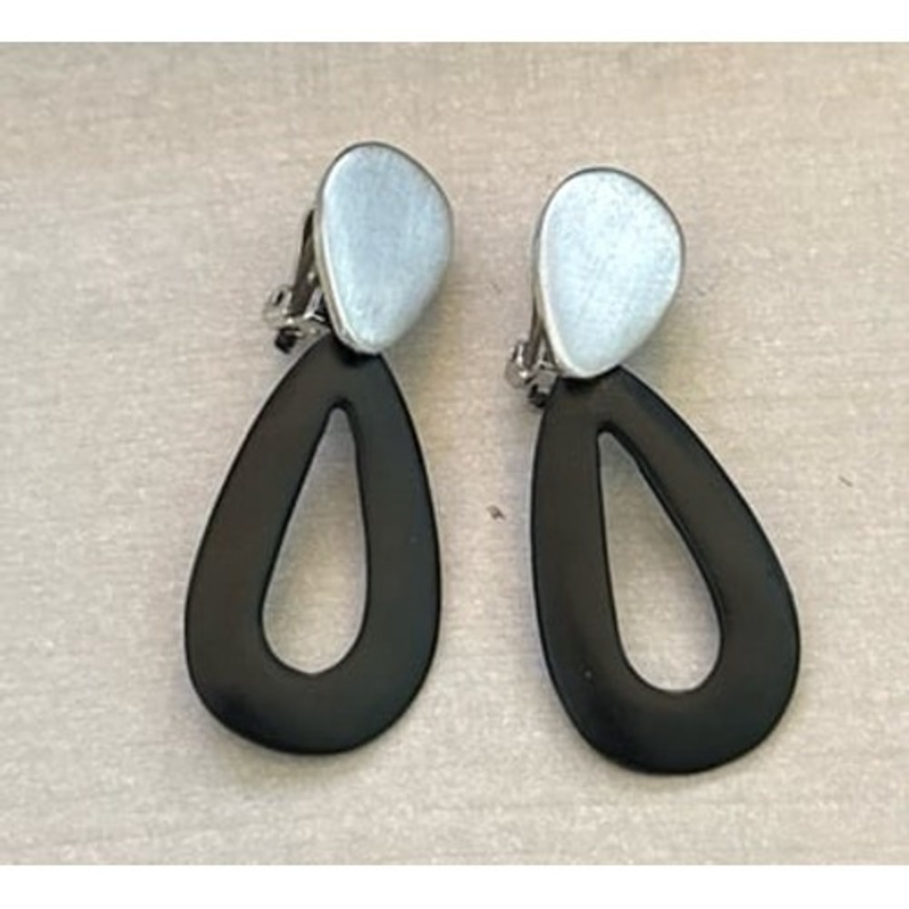 Matte black acrylic drop with‎ a silver-tone metal overlay clip-on earring